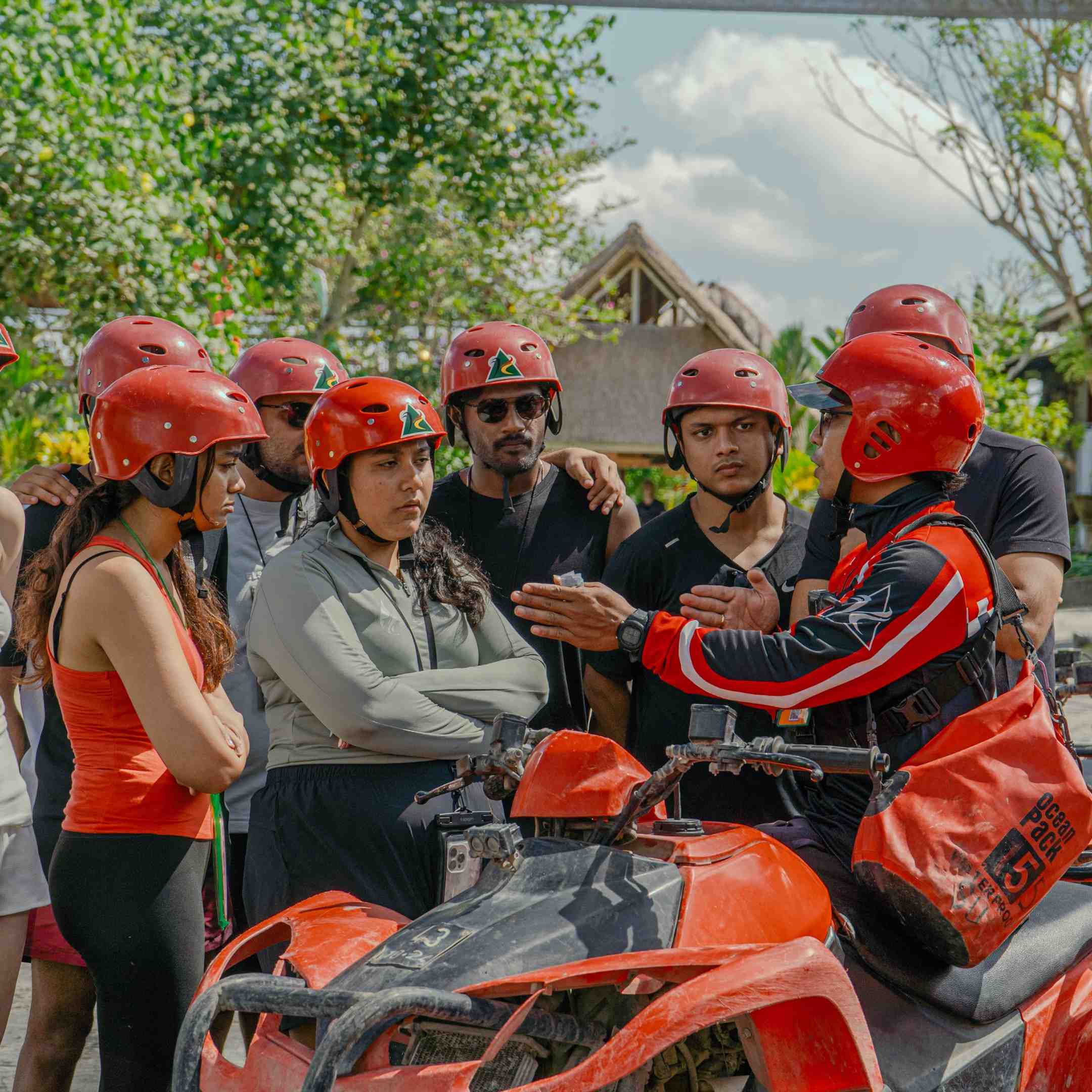 Guide leading a group of ATV riders through the Ubud jungle